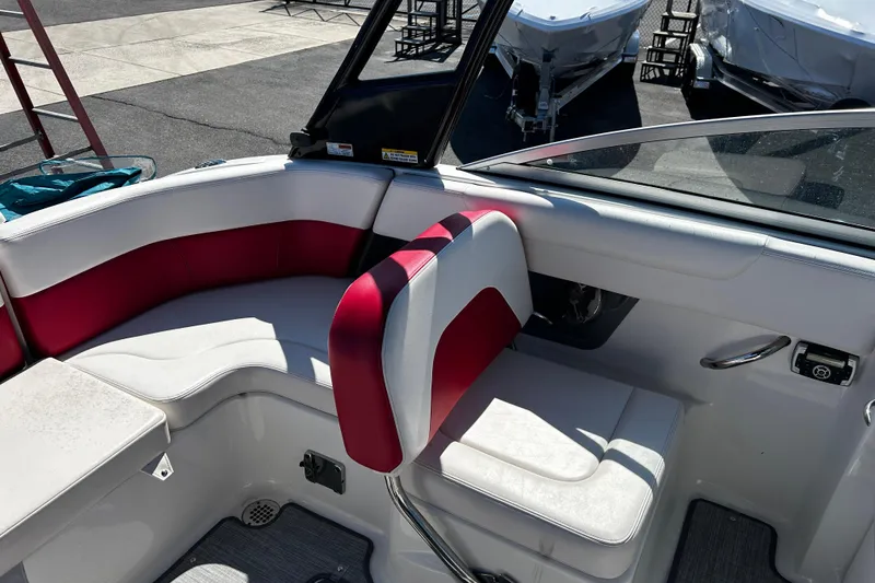Slide: The Image of Interior of 2016 Chaparral 210 Suncoast boat with red and white seating. - 18