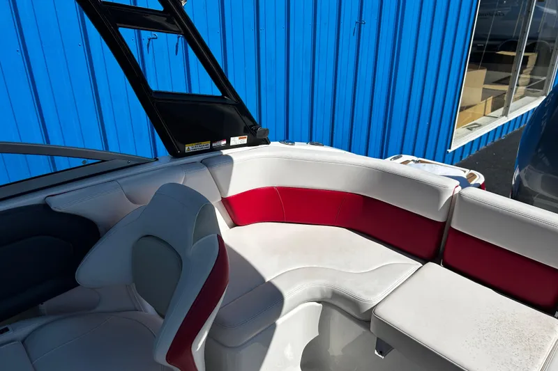Slide: The Image of Interior of 2016 Chaparral 210 Suncoast boat with red and white seating. - 19