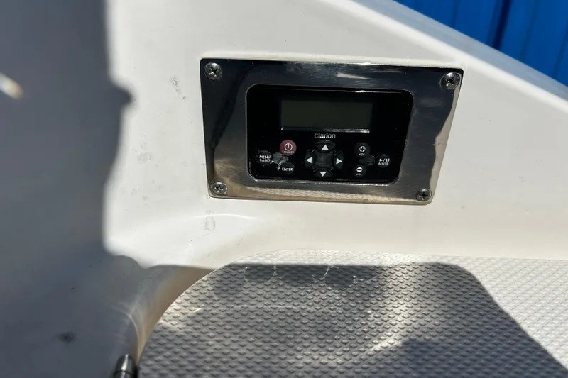 Slide: The Image of Control panel on 2016 Chaparral 210 Suncoast boat, featuring Clarion audio system. - 29