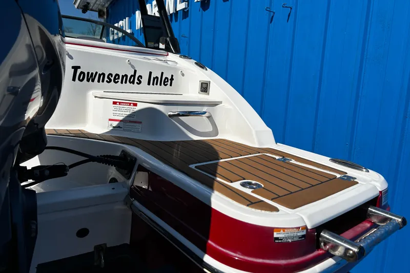Slide: The Image of 2016 Chaparral 210 Suncoast boat with teak deck, labeled "Townsends Inlet," against blue background. - 31