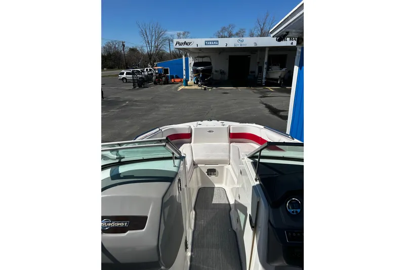 Slide: The Image of 2016 Chaparral 210 Suncoast boat interior at a marina service area. - 8