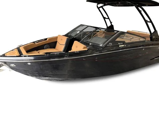 Slide: The Image of 2026 Cobalt R4 Surf boat with black hull and brown seats. - 2