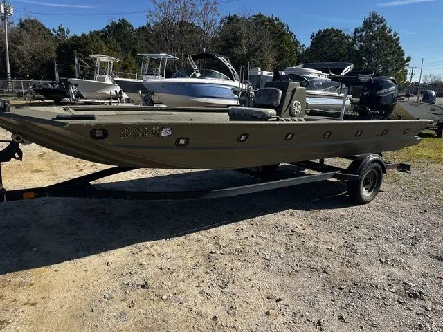 The Image of 2021 Tracker TRACKER 1860 MVX boat on trailer outdoors. - 1