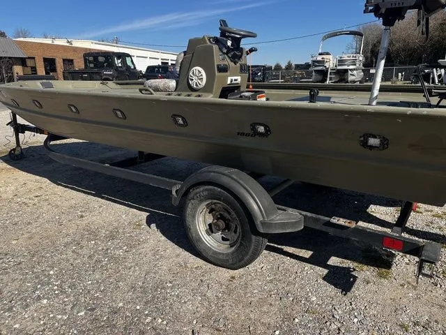 Slide: The Image of 2021 Tracker TRACKER 1860 MVX boat on trailer outdoors. - 15
