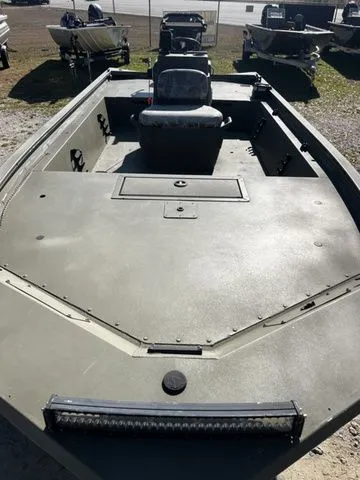 Slide: The Image of 2021 Tracker TRACKER 1860 MVX aluminum boat in a parking lot. - 6