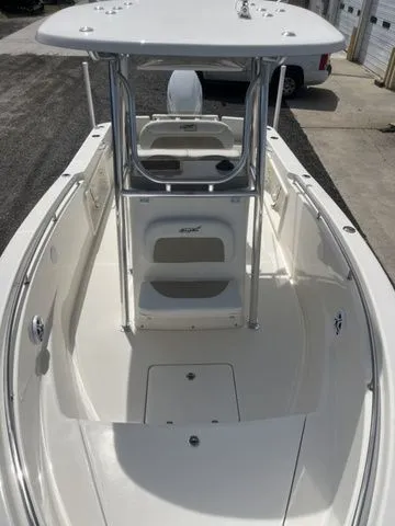 Slide: The Image of 2026 Bulls Bay 230CC boat, silver, front deck view at dock. - 10