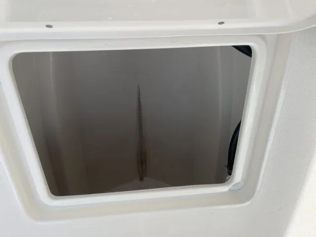 Slide: The Image of Interior of 2026 Bulls Bay 230CC boat, storage compartment view. - 14