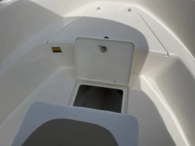 Slide: The Image of Interior view of 2026 Bulls Bay 230CC boat, storage compartment open. - 15