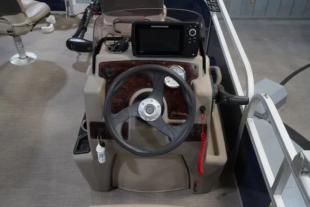 Slide: The Image of 2020 Sun Tracker Bass Buggy® 16 XL helm with steering wheel and instruments. - 15