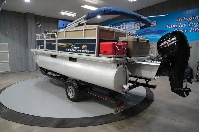Slide: The Image of 2020 Sun Tracker Bass Buggy® 16 XL pontoon boat in a showroom. - 9