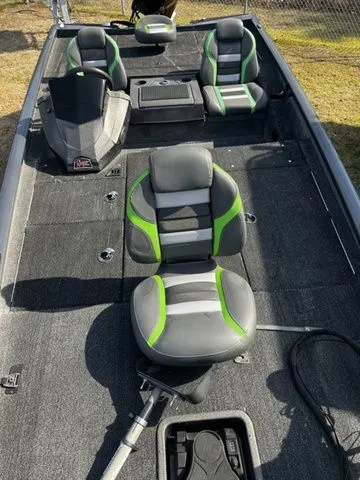 Slide: The Image of Interior view of a 2021 Ranger RT188P boat with gray and green seats. - 14