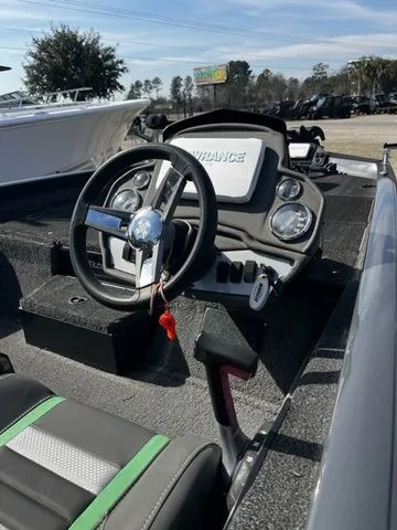 Slide: The Image of Interior view of a 2021 Ranger RT188P boat with steering console. - 5