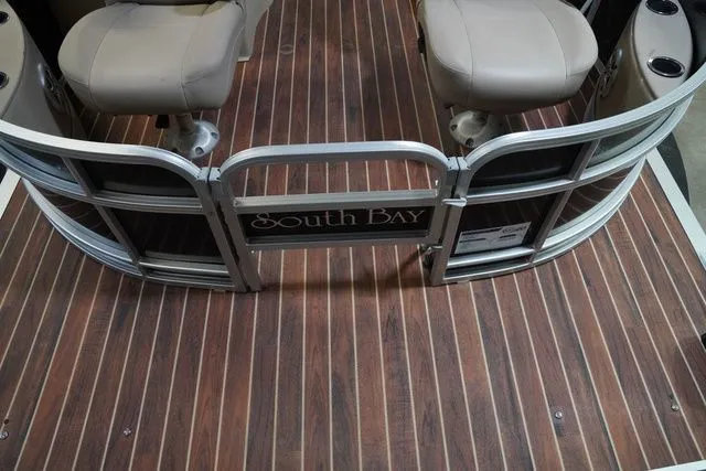 Slide: The Image of Interior of a 2015 South Bay 424FCR pontoon boat with wooden flooring. - 11