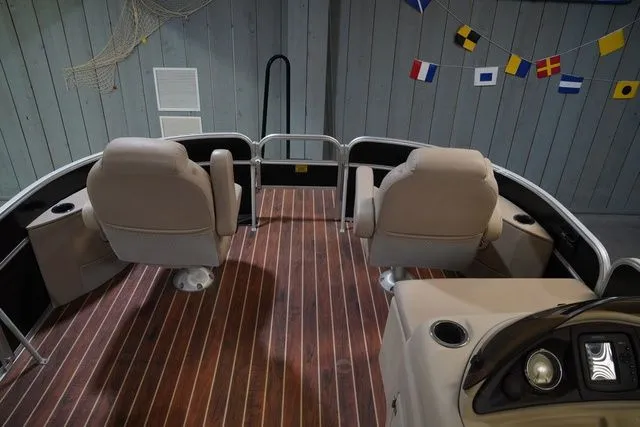 Slide: The Image of Interior of a 2015 South Bay 424FCR boat with wooden flooring. - 13