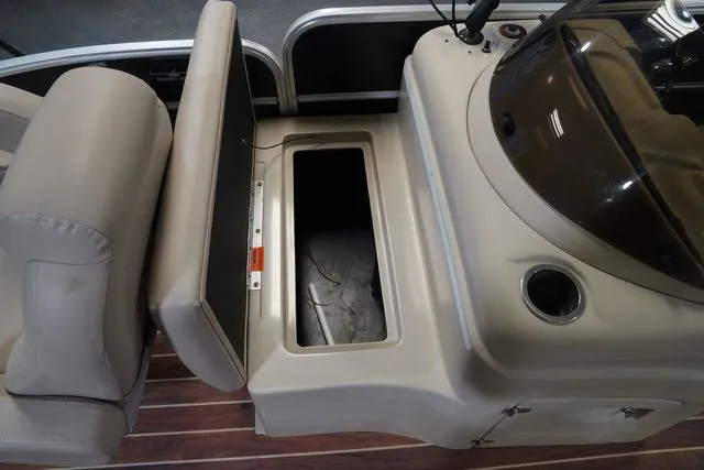 Slide: The Image of Interior of a 2015 South Bay 424FCR boat with storage compartment. - 14