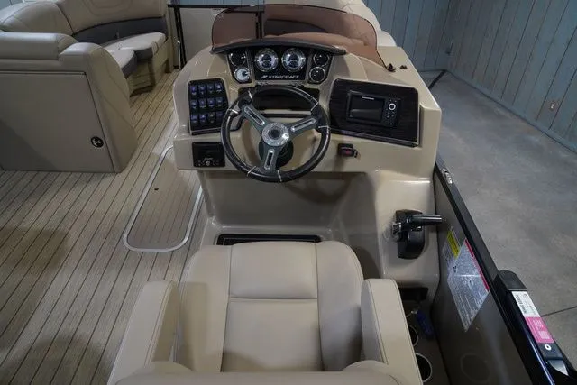 Slide: The Image of Interior of 2024 Starcraft SLS 3 Q DH boat with helm console. - 15