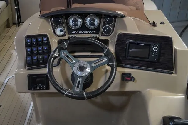 Slide: The Image of 2024 Starcraft SLS 3 Q DH dashboard with steering wheel and instruments. - 16