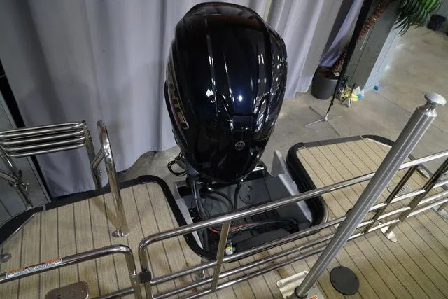 Slide: The Image of 2024 Starcraft SLS 3 Q DH boat motor and deck view. - 21