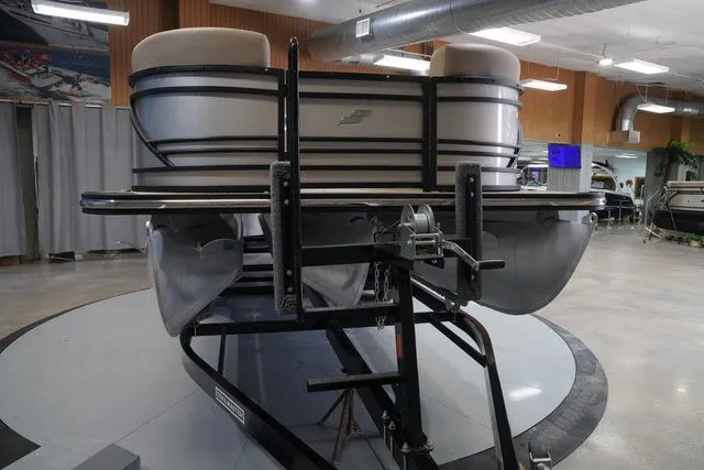 Slide: The Image of 2024 Starcraft SLS 3 Q DH pontoon boat in showroom. - 4