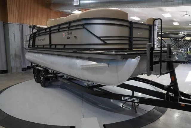 Slide: The Image of 2024 Starcraft SLS 3 Q DH pontoon boat on trailer indoors. - 5