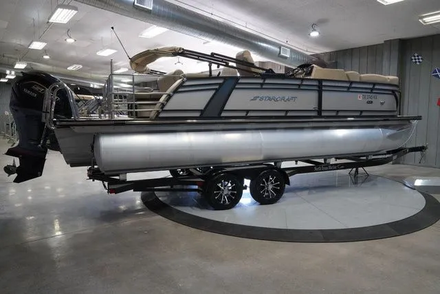 Slide: The Image of 2024 Starcraft SLS 3 Q DH pontoon boat in showroom. - 7