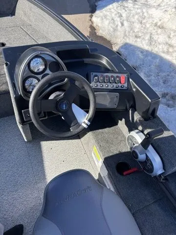 Slide: The Image of Interior of 2026 Alumacraft Classic 165 Side Console with steering console. - 10