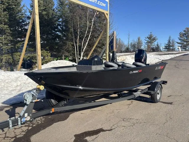 Slide: The Image of 2026 Alumacraft Classic 165 Side Console boat on trailer outdoors. - 2
