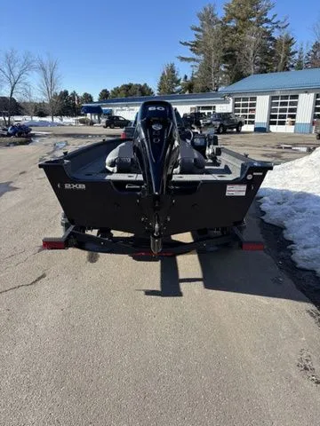 Slide: The Image of 2026 Alumacraft Classic 165 Side Console boat on trailer outdoors. - 7