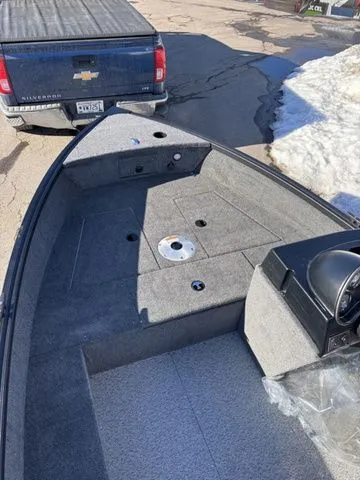 Slide: The Image of 2026 Alumacraft Classic 165 Side Console on trailer, snowy background. - 9