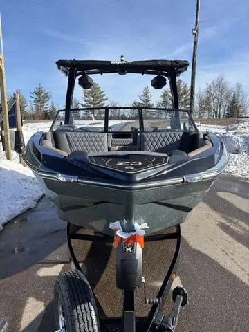 Slide: The Image of 2026 Tigé Z3 boat parked on trailer in snowy setting. - 3