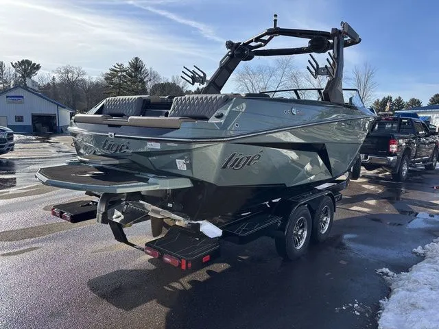 Slide: The Image of 2026 Tigé Z3 boat parked outdoors on a trailer. - 6