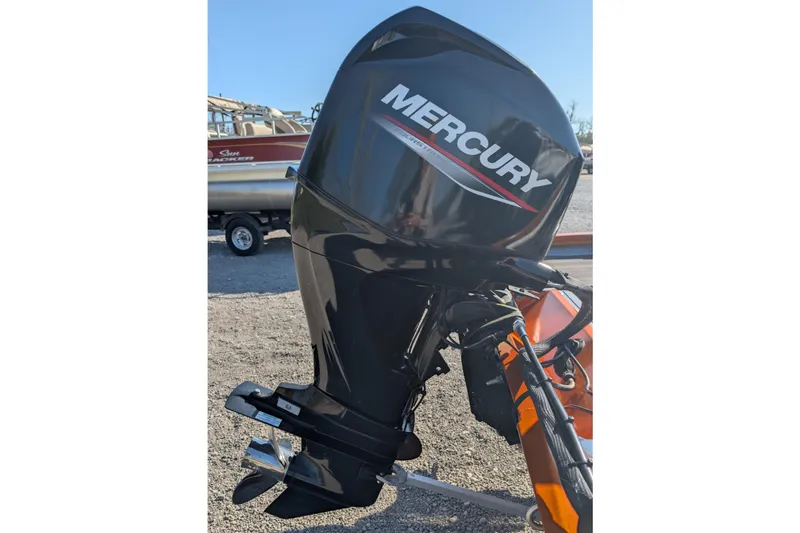 Slide: The Image of Mercury outboard motor on 2022 Lowe Stinger 175 boat, parked on gravel. - 4