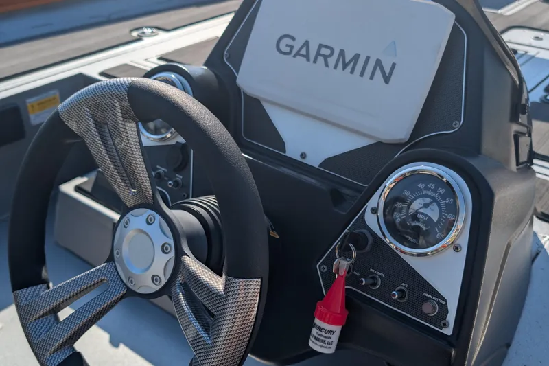 Slide: The Image of Steering console of 2022 Lowe Stinger 175 boat with Garmin navigation system. - 6