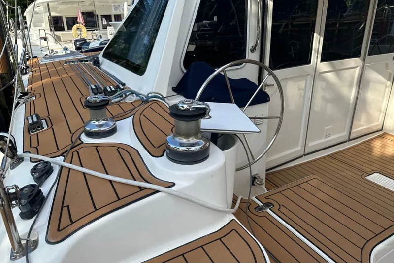 Slide: The Image of Sailboat deck of 2005 Seawind 1160 with steering wheel and winches. - 12