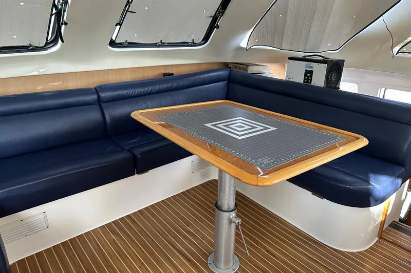 Slide: The Image of Interior of 2005 Seawind 1160 catamaran featuring modern kitchen with dual sinks and ample storage. - 16