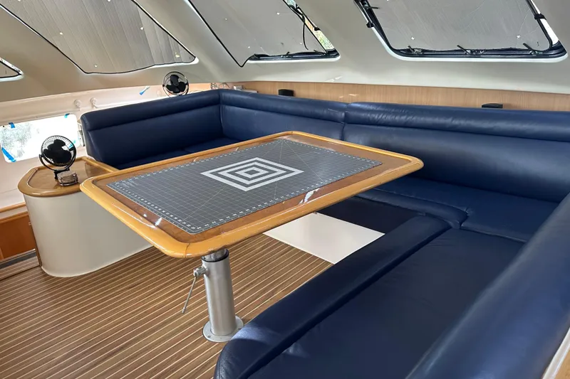 Slide: The Image of Interior view of a 2005 Seawind 1160 catamaran kitchen with storage and appliances. - 17