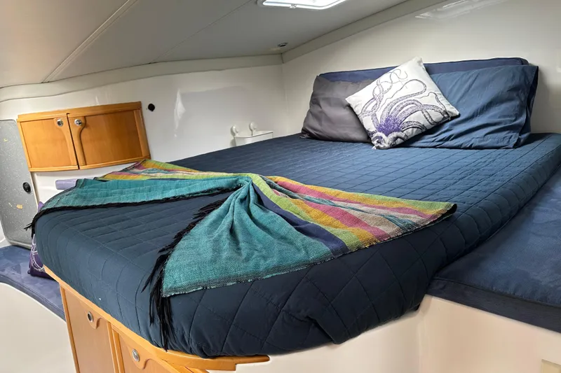 Slide: The Image of Cozy cabin interior of 2005 Seawind 1160 catamaran with comfortable bedding and colorful decor. - 26