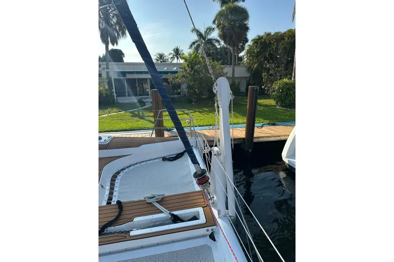 Slide: The Image of Spacious deck of a 2005 Seawind 1160 catamaran with wooden flooring and dual steering wheels. - 6