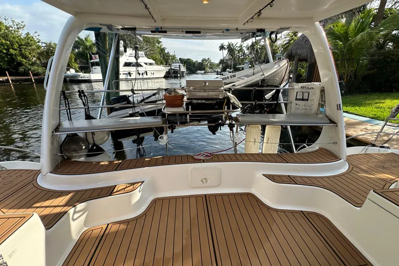 Slide: The Image of Seawind 1160 catamaran deck, 2005 model, docked with scenic waterfront view. - 7