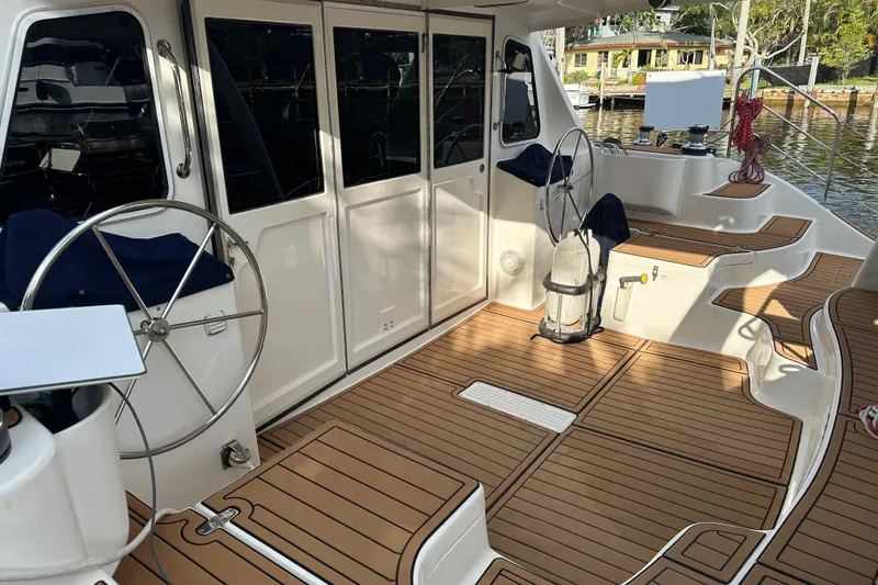 Slide: The Image of Seawind 1160 catamaran deck with winches and steering wheel, 2005 model. - 8