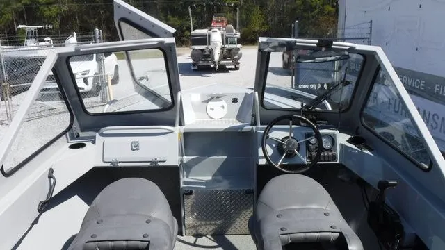 Slide: The Image of Interior view of a 2018 Hewescraft Sportsman 160 boat outdoors. - 11