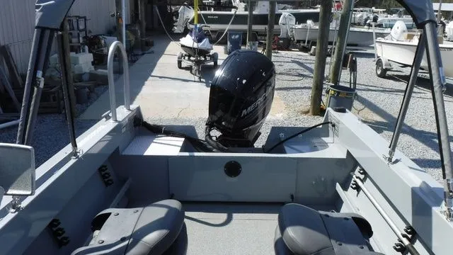 Slide: The Image of Interior view of a 2018 Hewescraft Sportsman 160 boat at the dock. - 12