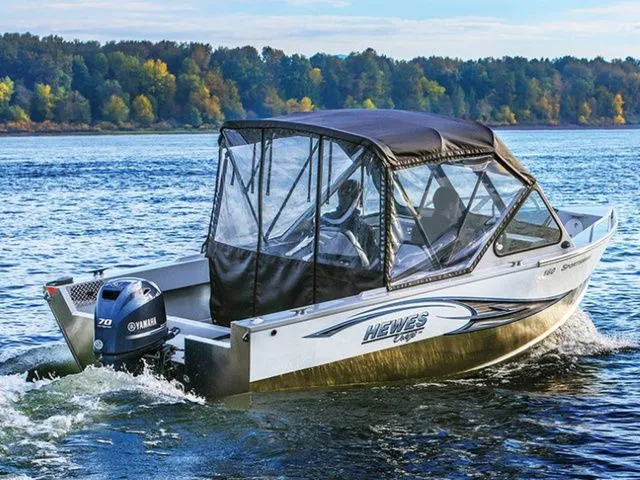 Slide: The Image of 2018 Hewescraft Sportsman 160 boat on a lake. - 15