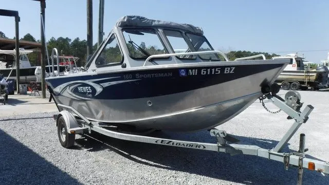 Slide: The Image of 2018 Hewescraft Sportsman 160 boat on trailer. - 6