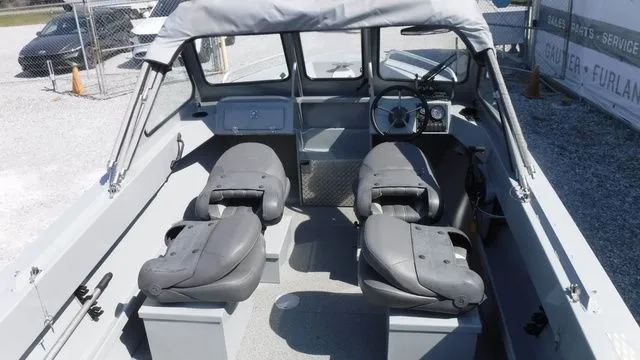 Slide: The Image of Interior of a 2018 Hewescraft Sportsman 160 boat with gray seats. - 8