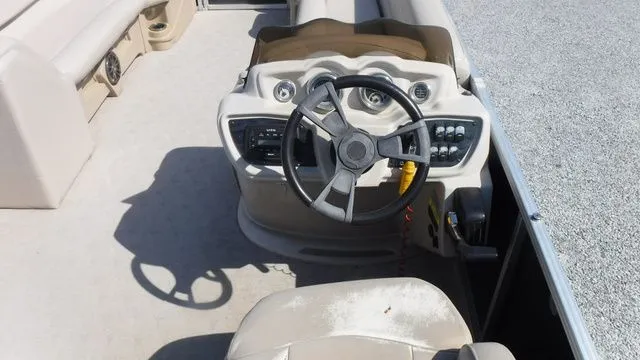Slide: The Image of Interior of a 2018 Tahoe LTZ Cruise 24' boat with steering console. - 10