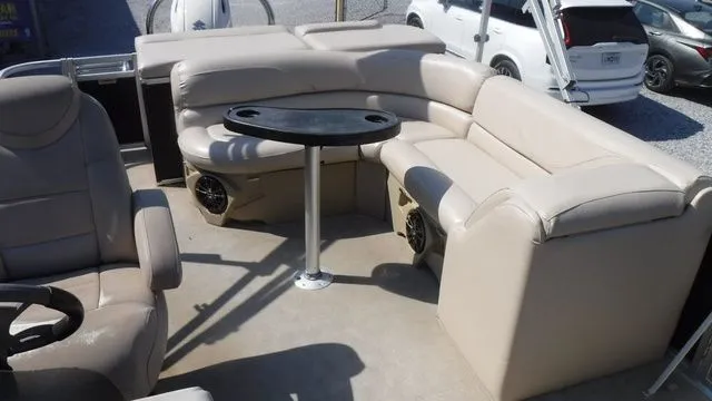 Slide: The Image of Interior of a 2018 Tahoe LTZ Cruise 24' with beige seating. - 11