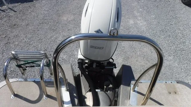 Slide: The Image of 2018 Tahoe LTZ Cruise 24' boat with outboard motor. - 13