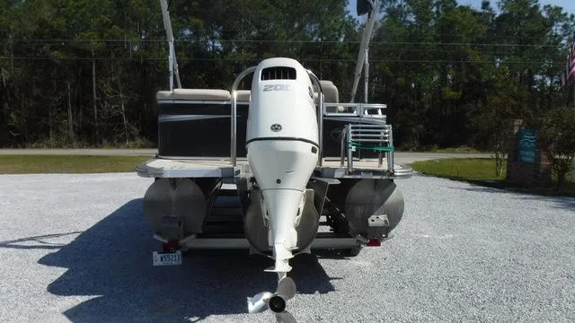 Slide: The Image of 2018 Tahoe LTZ Cruise 24' pontoon boat with outboard motor. - 3