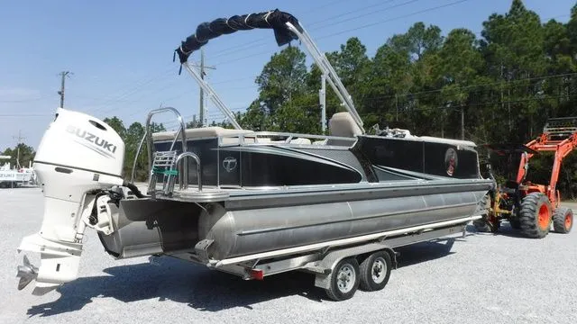 Slide: The Image of 2018 Tahoe LTZ Cruise 24' pontoon boat with Suzuki motor on trailer. - 4